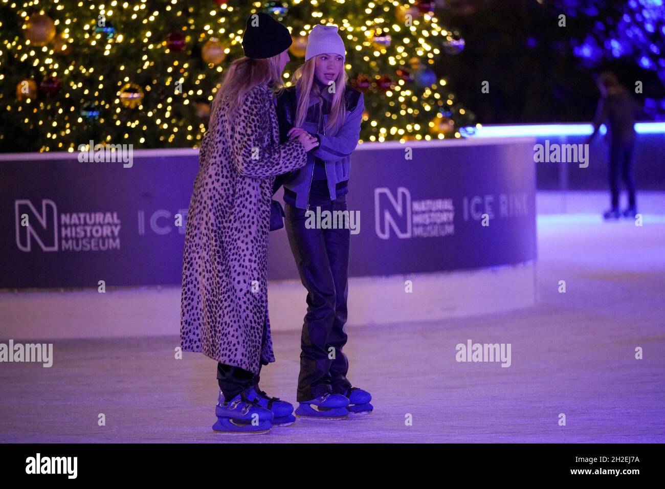 Lila Moss Hack (right) skating during the launch party for the annual Natural History Museum ice rink in London. Picture date: Thursday October 21, 2021. Stock Photo