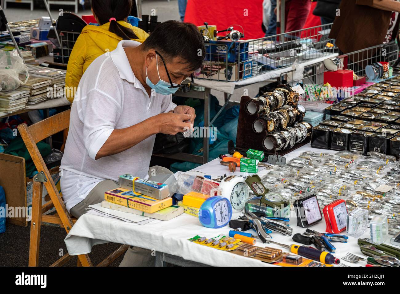 Street vendor selling clocks and watches at Mercato di Porta Portese street market in Trastevere district of Rome, Italy Stock Photo