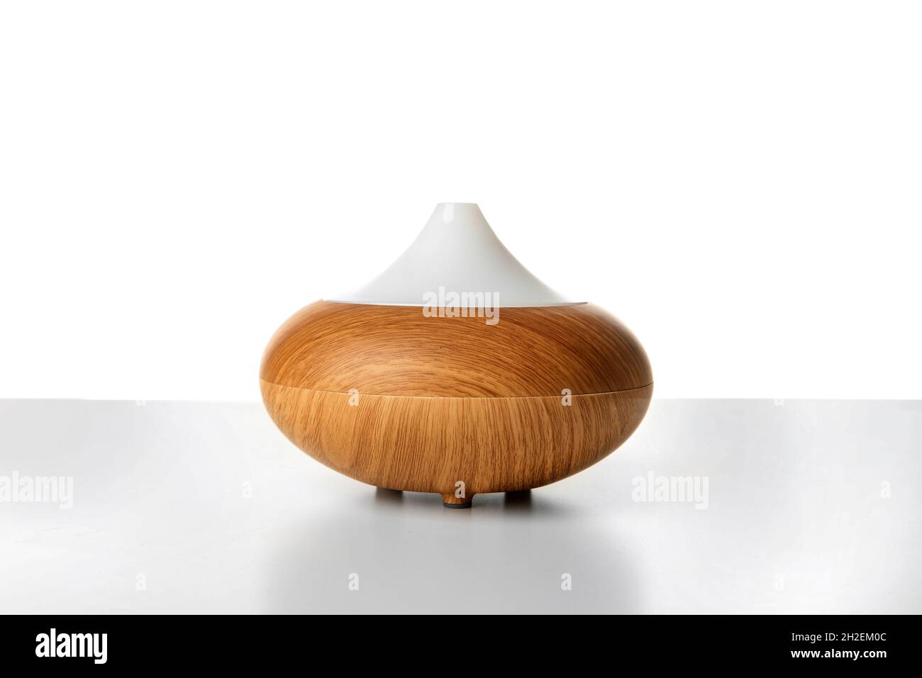Aroma oil diffuser lamp on white background Stock Photo Alamy