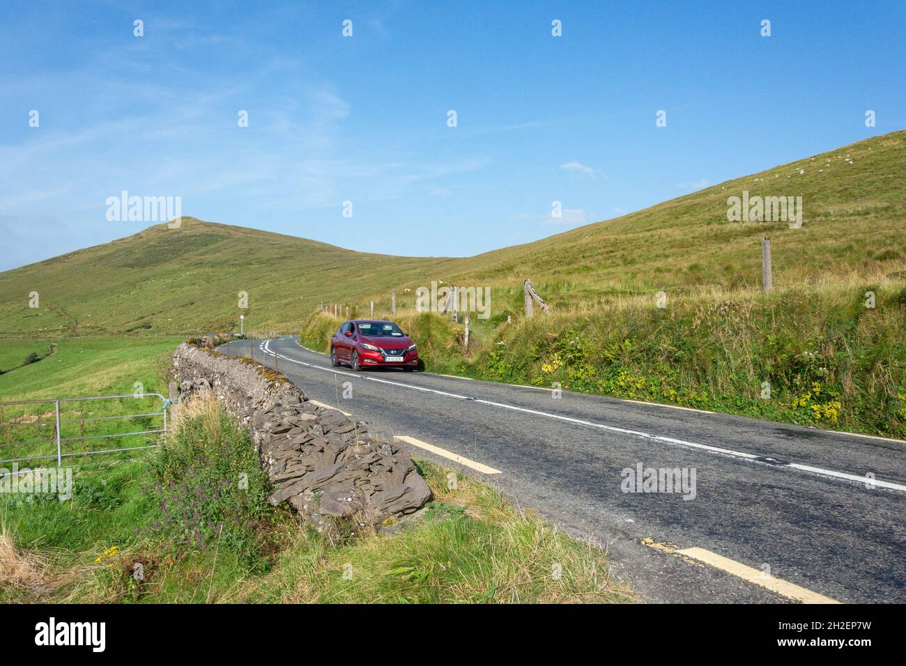 Car driving on the N86 road to Dingle, Dingle Peninsula (Corca Dhuibhne), County Kerry, Republic