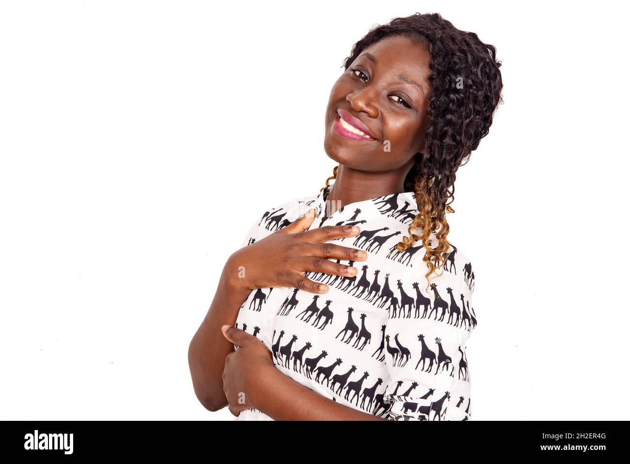 Woman smiling hands chest hi-res stock photography and images - Alamy