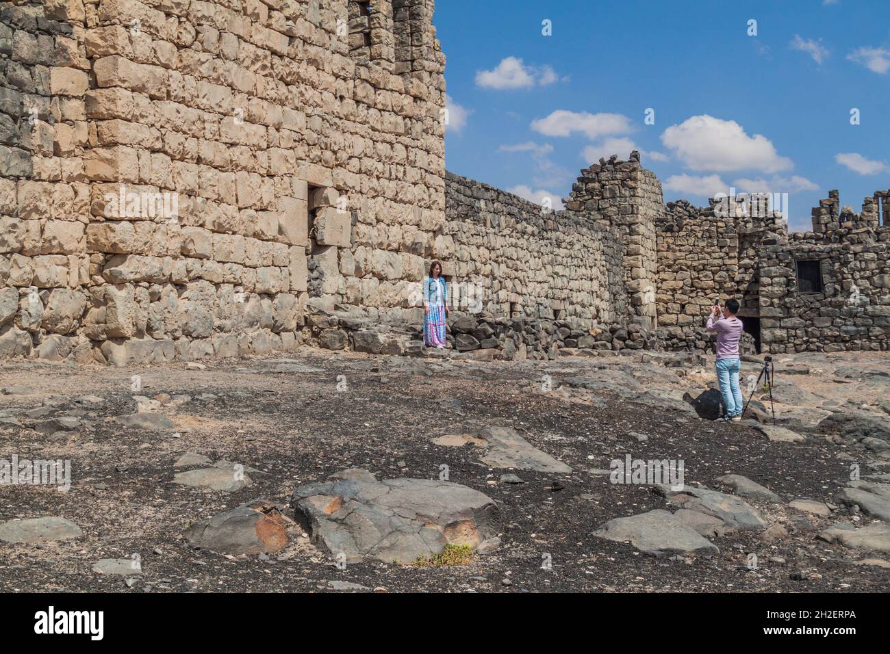 QASR AL-AZRAQ, JORDAN - APRIL 3, 2017: Tourists at Qasr al-Azraq Blue ...