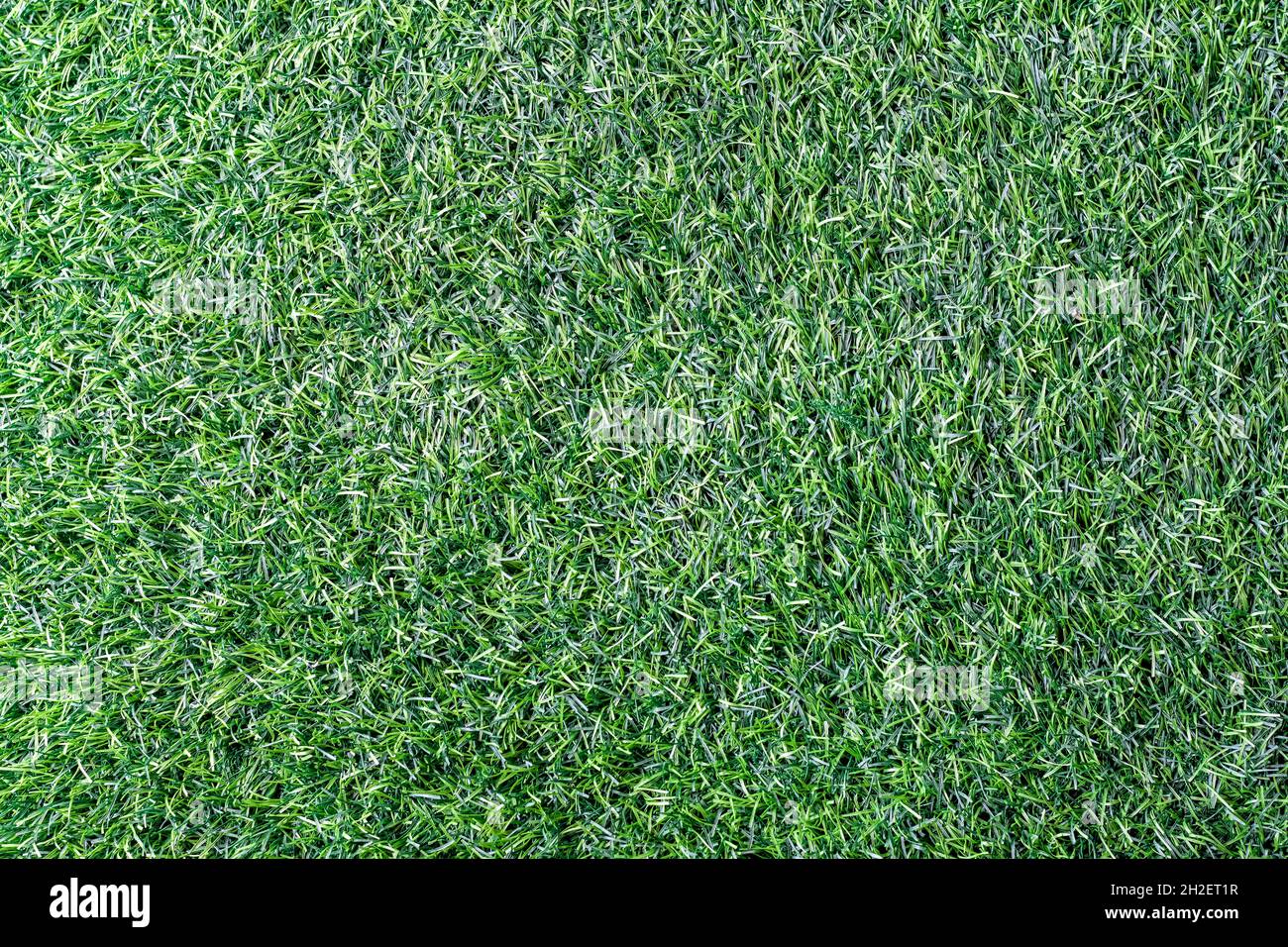 Artificial green plastic grass texture background Stock Photo
