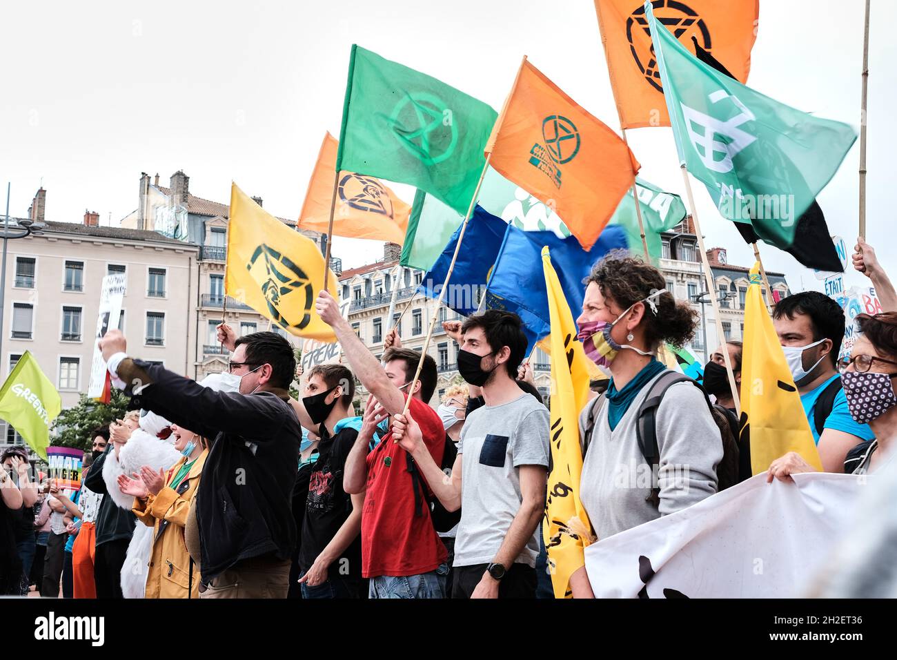 Extinction rebellion protester with flags at the Climate Change Protest in Lyon France Stock Photo