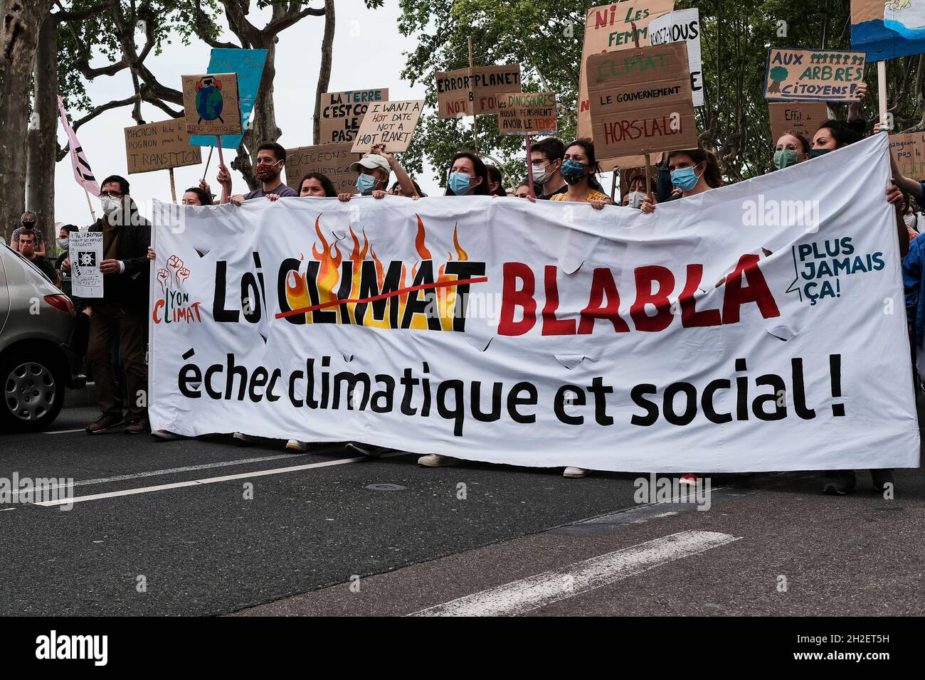 Climate protester holding up a sign at the Climate Change Protest in Lyon France Stock Photo