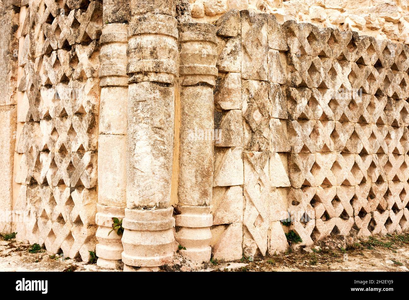 Geometric designs on the wall of a building at the  Mayan ruins of Kabah,  Puuc Route, Yucatan, Mexico Stock Photo
