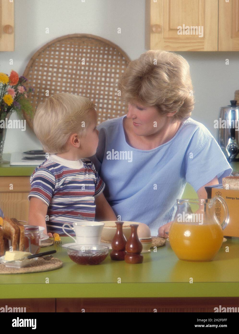 Mother and child. Breakfast at home. Stock Photo