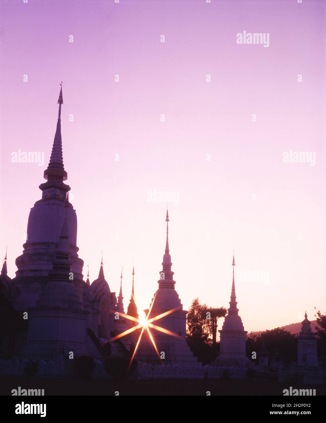 Thailand. Wat Mahathat Temple. Chedis at sunset. Stock Photo