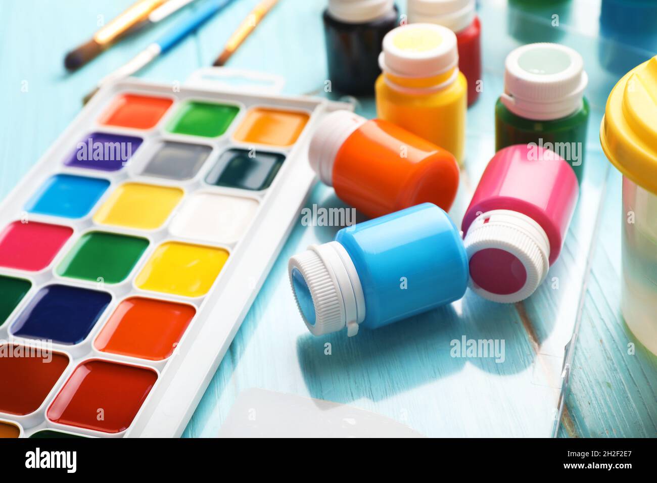 Set of painting materials for child on color table Stock Photo - Alamy