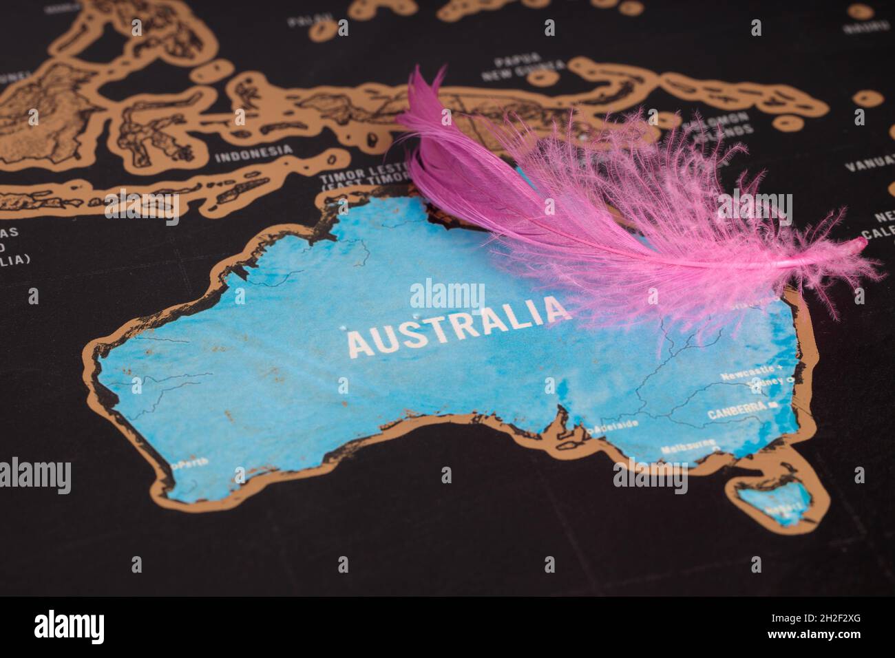 Location Australia. Bird feather on the map. Close-up map Australia. Stock Photo