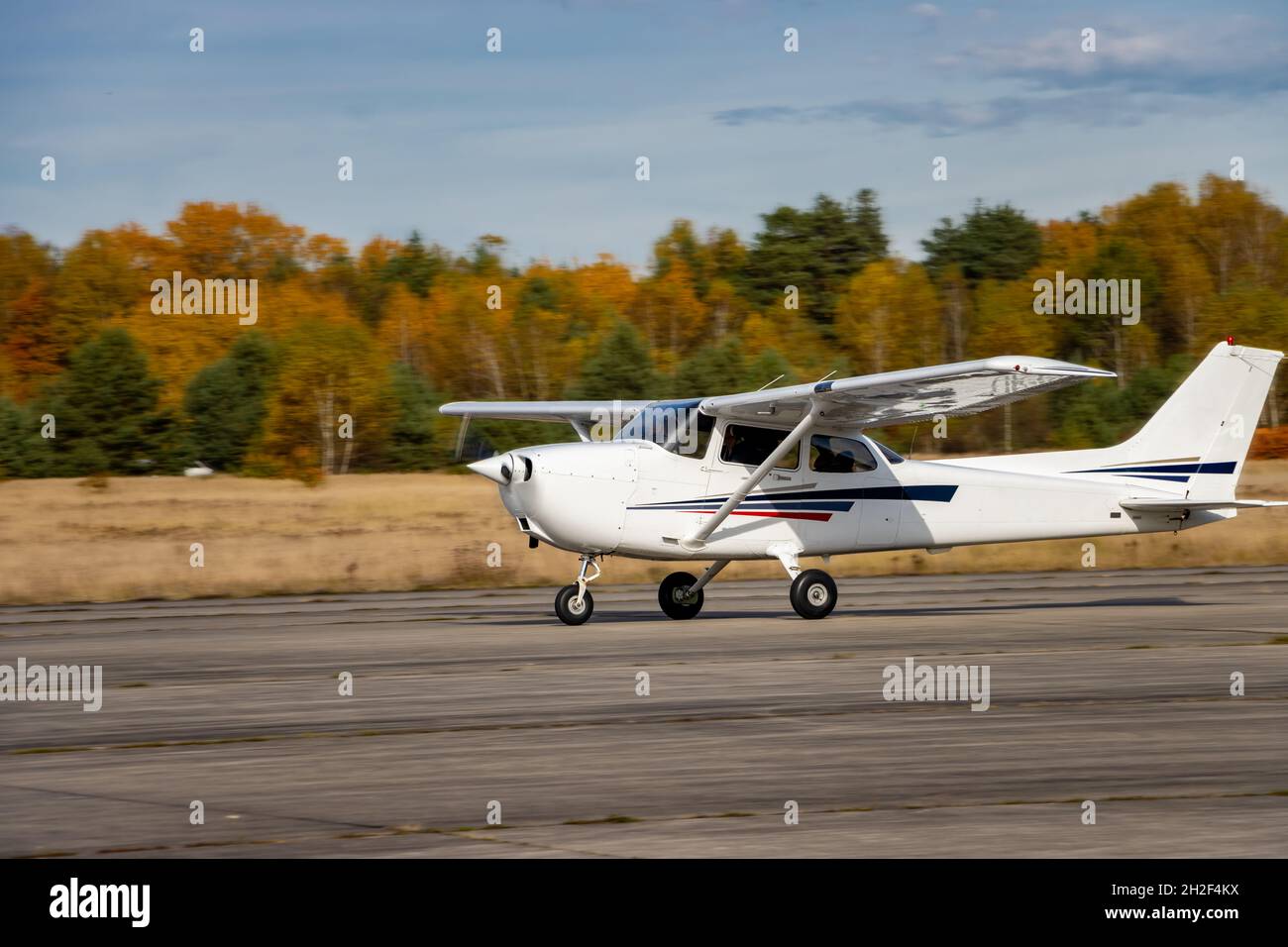 Start of a small plane on the runway Stock Photo