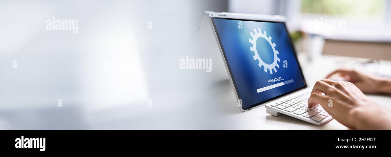 Hybrid Man Software Online Update. Laptop OS Stock Photo