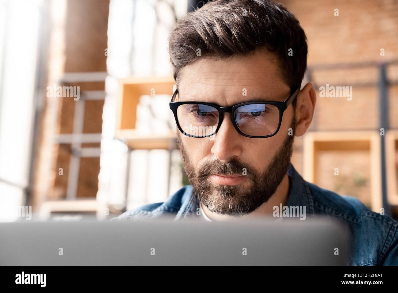 Man wearing glasses laptop hi-res stock photography and images - Alamy