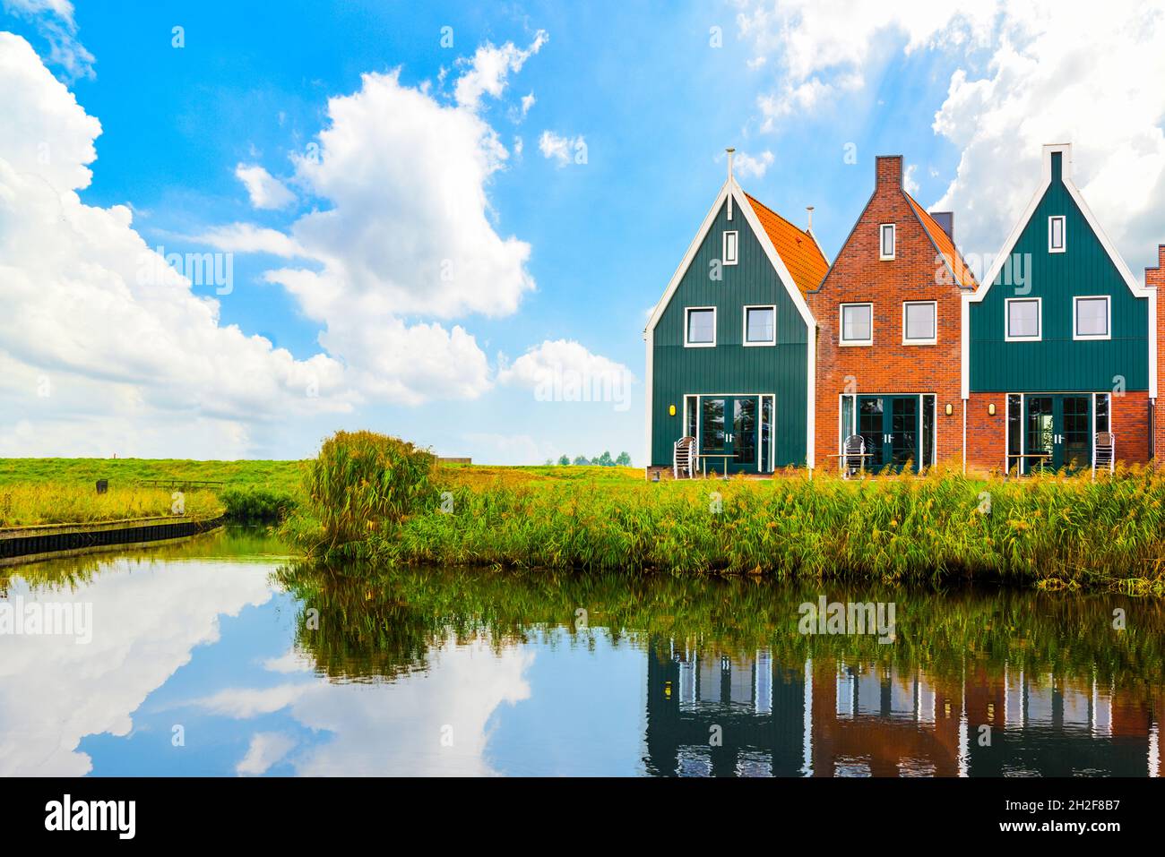 Volendam is a town in North Holland in the Netherlands. Colored houses of marine park in Volendam. North Holland, Netherlands. Stock Photo