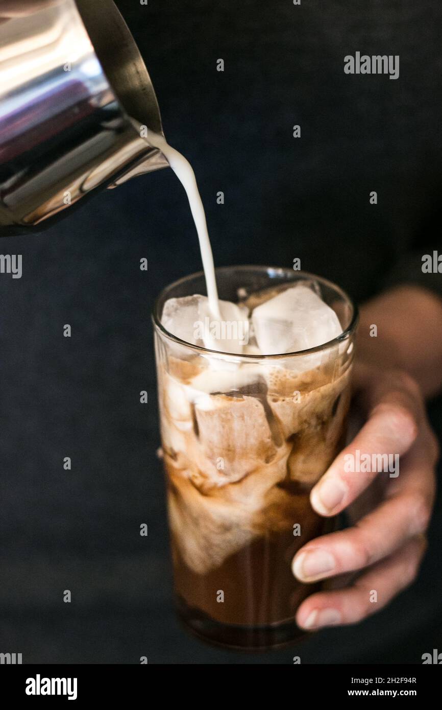 Mom making iced coffee to drink for breakfast Stock Photo