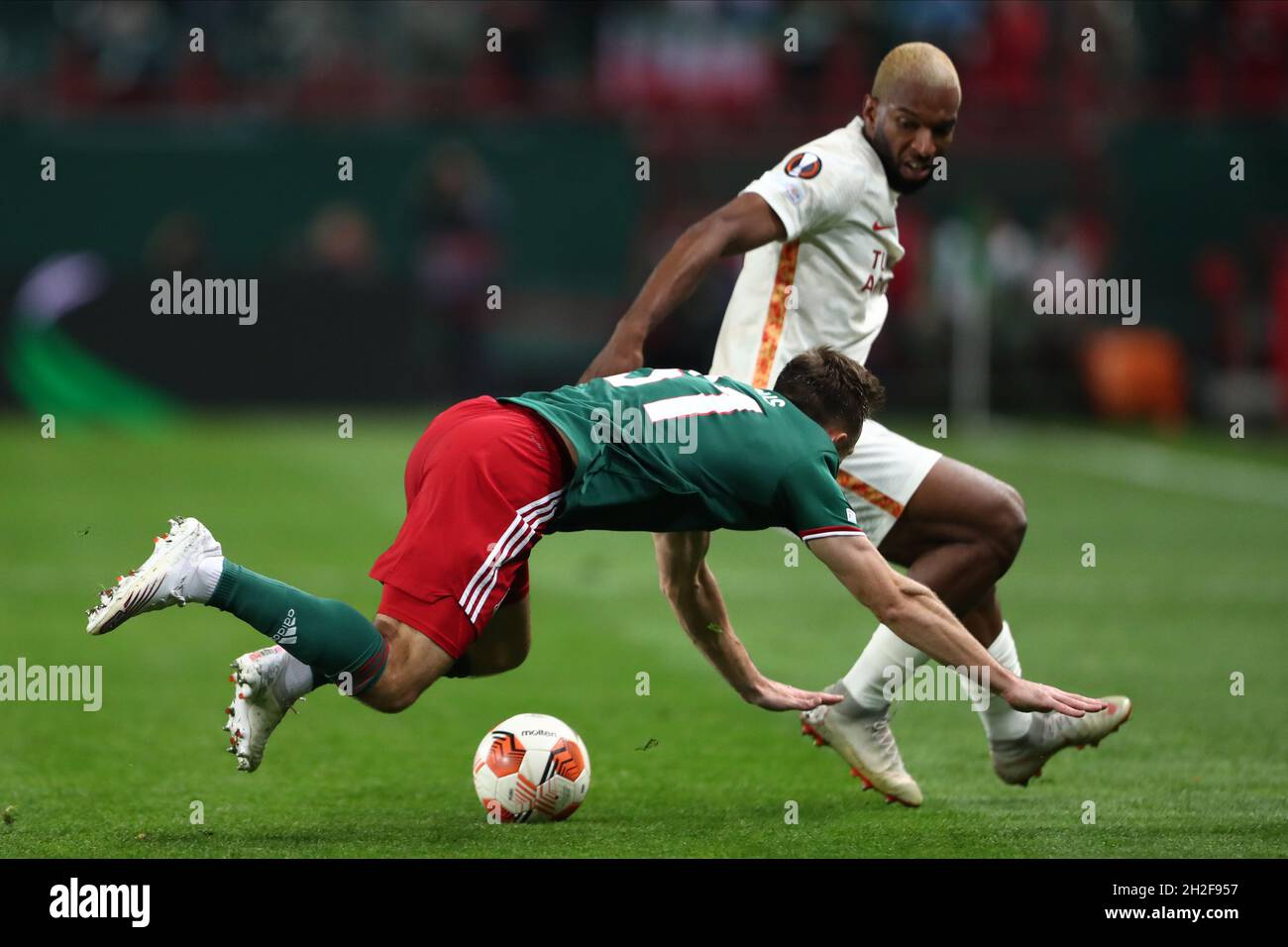 Moscow. MOSCOW,  - OCTOBER 21: defender Maciej Rybus of FC Lokomotiv and forward Ryan Babel of FC Galatasaray during UEFA Europa League Group stage match FC Lokomotiv v FC Galatasaray at Lokomotiv Stadium in Moscow. MOSCOW,  - OCTOBER 21: (Photo by Anatoliy Medved) Stock Photo