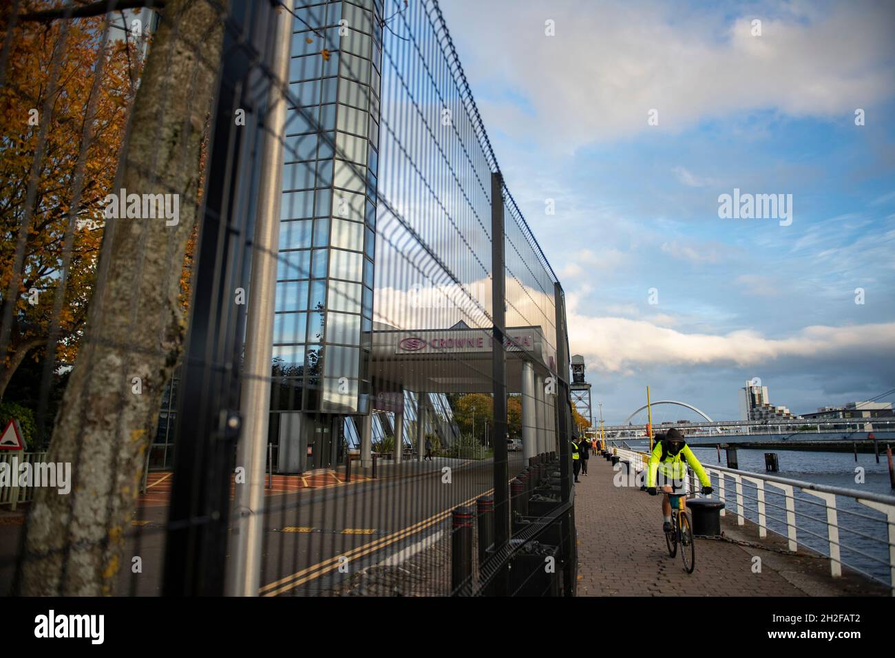Glasgow, Scotland, UK. 21st Oct, 2021. PICTURED: The security perimeter fence to prevent any protestors gaining entry to the COP26 site. 10 days until the start of COP26. The COP26 site showing temporary structures half built on the grounds of the Scottish Event Campus (SEC) Previously known as Scottish Exhibition and Conference Centre (SECC). Security fences with a ‘ring of steel' encapsulates the COP26 conference site. CCTV stations with emergency lights and loudspeakers are positioned all over the site. Credit: Colin Fisher/Alamy Live News Stock Photo