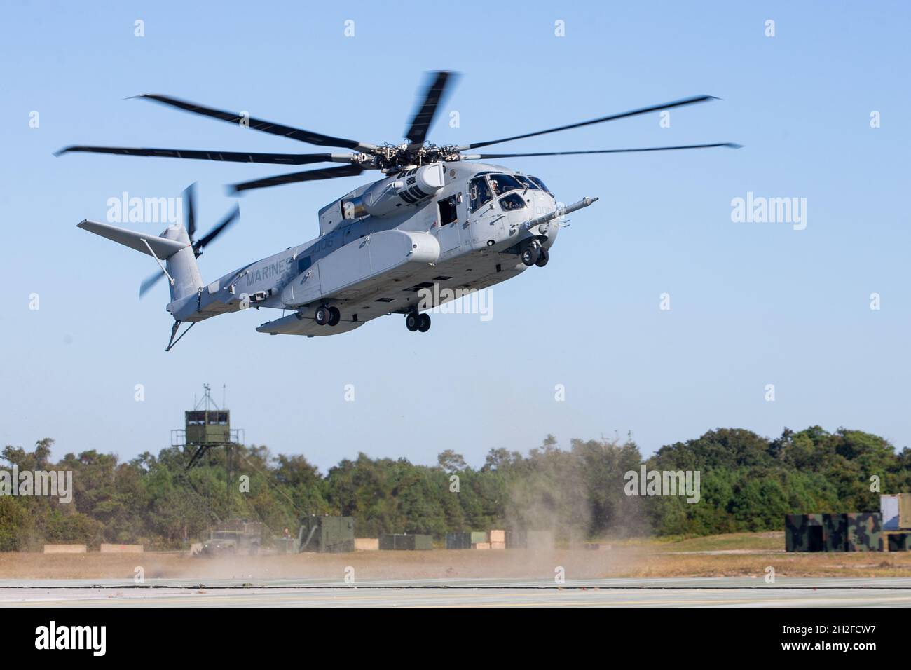 A CH-53K King Stallion assigned to Marine Operational Test and Evaluation Squadron (VMX) 1 prepares to land at Marine Corps Auxiliary Landing Field Bogue, North Carolina, Oct. 20, 2021. The CH-53K King Stallion will replace the CH-53E Super Stallion, which has served the Marine Corps for 40 years, and will transport Marines, heavy equipment, and supplies during ship-to-shore movement in support of amphibious assault and subsequent operations ashore. (U.S. Marine Corps photo by Lance Cpl. Elias E. Pimentel III) Stock Photo