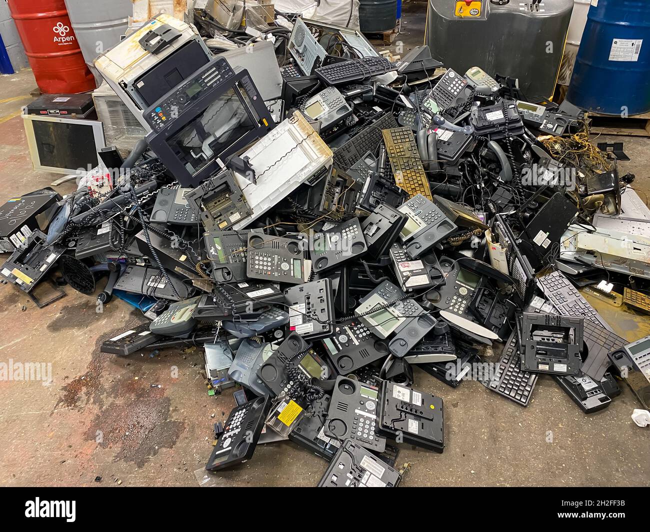 Old telephones and electronic scrap to be recycled Stock Photo