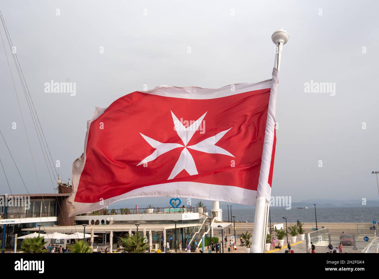 Maltese flag on a luxury boat anchored in the marina of Greece ...