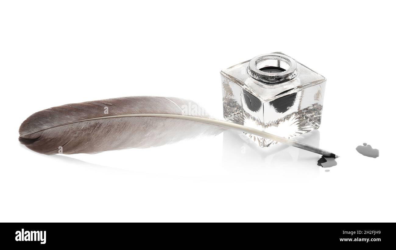Feather pen and inkwell on white background Stock Photo - Alamy