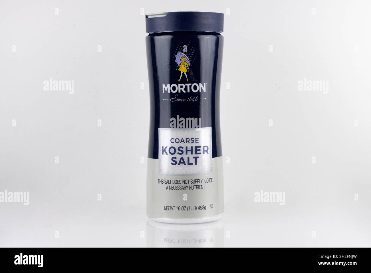 bottle of Morton brand coarse kosher salt on a white background with copy space, a non-iodide form of salt Stock Photo