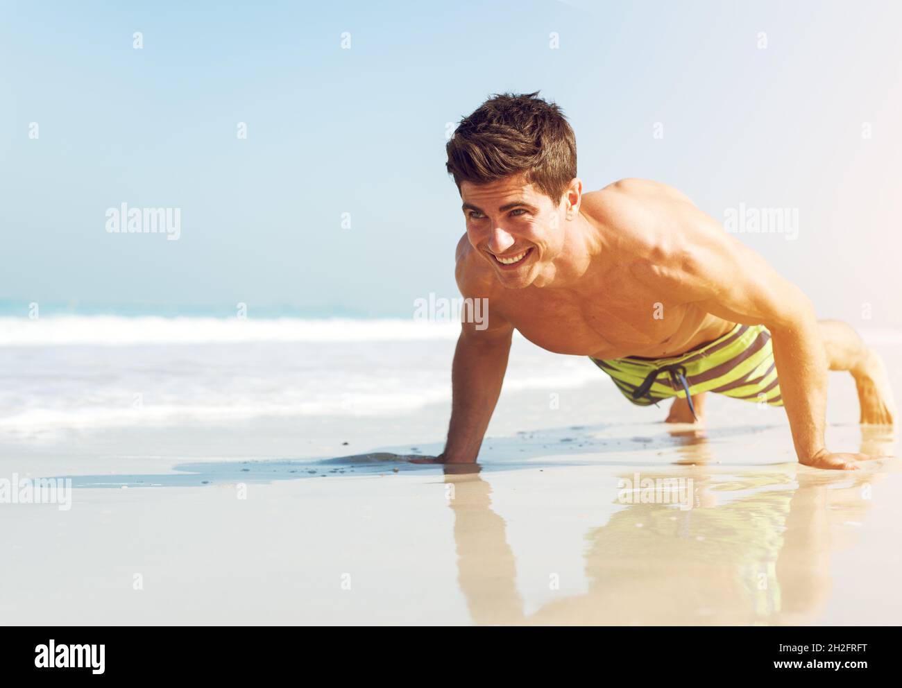 Beach man push up hi-res stock photography and images - Alamy