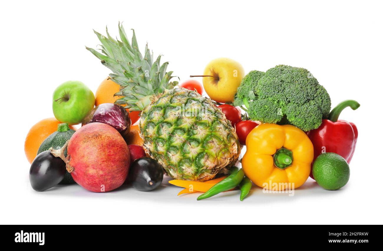 Rainbow collection of ripe fruits and vegetables on white background ...