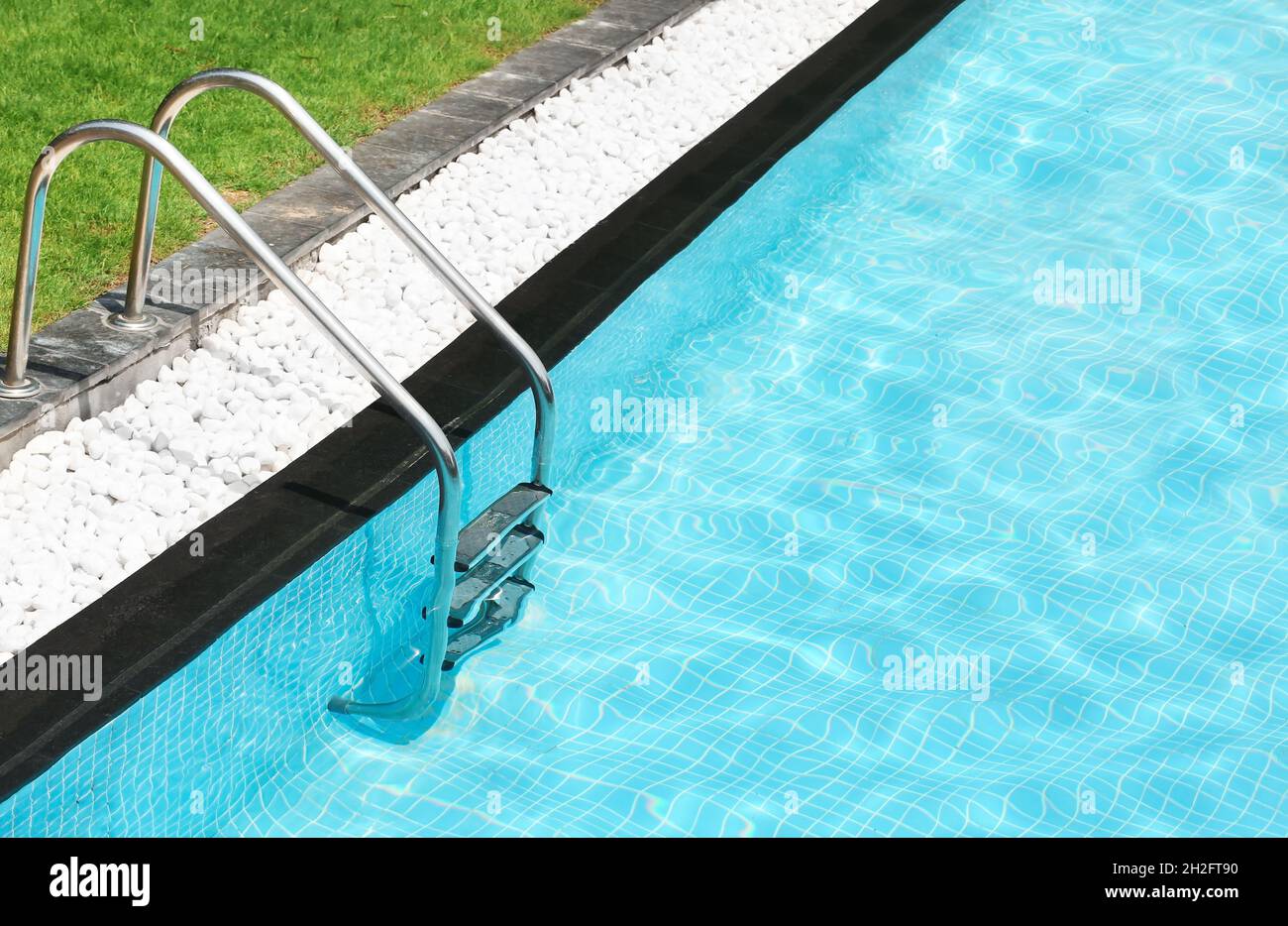 Modern swimming pool with stairs at resort Stock Photo Alamy