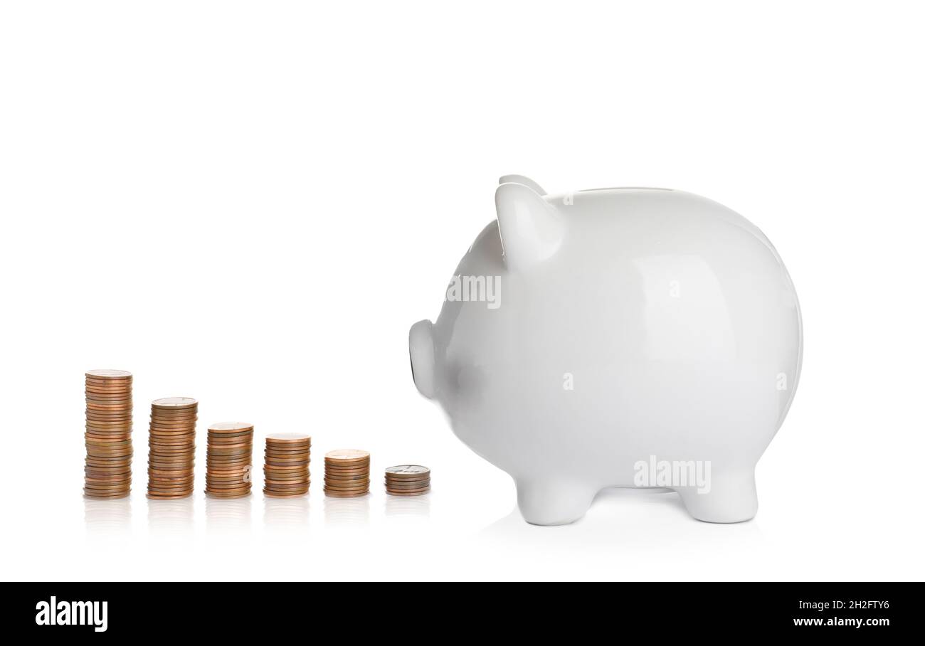 Ceramic piggy bank and many coins on white background Stock Photo - Alamy