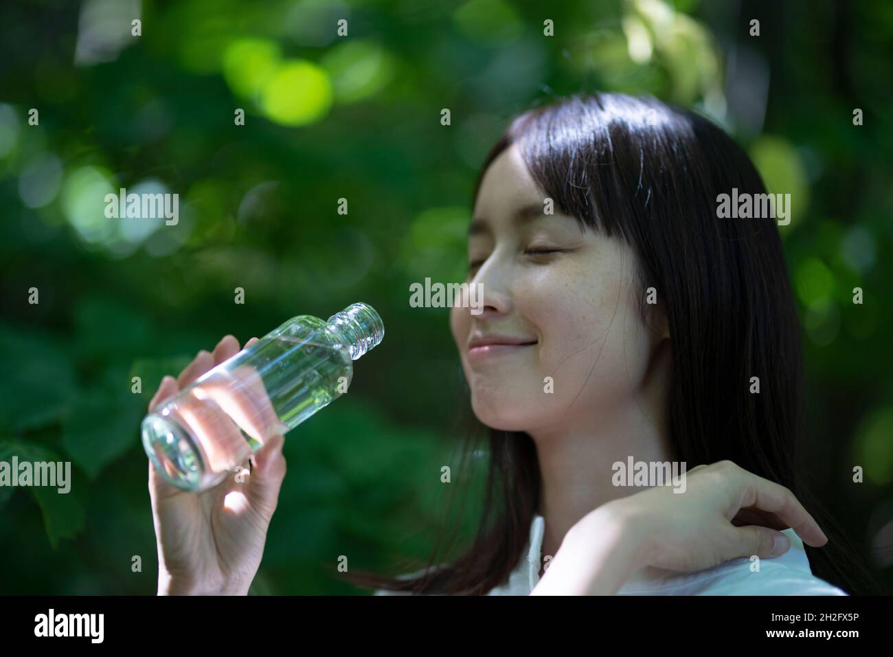 Woman Having Mineral Water Stock Photo Alamy