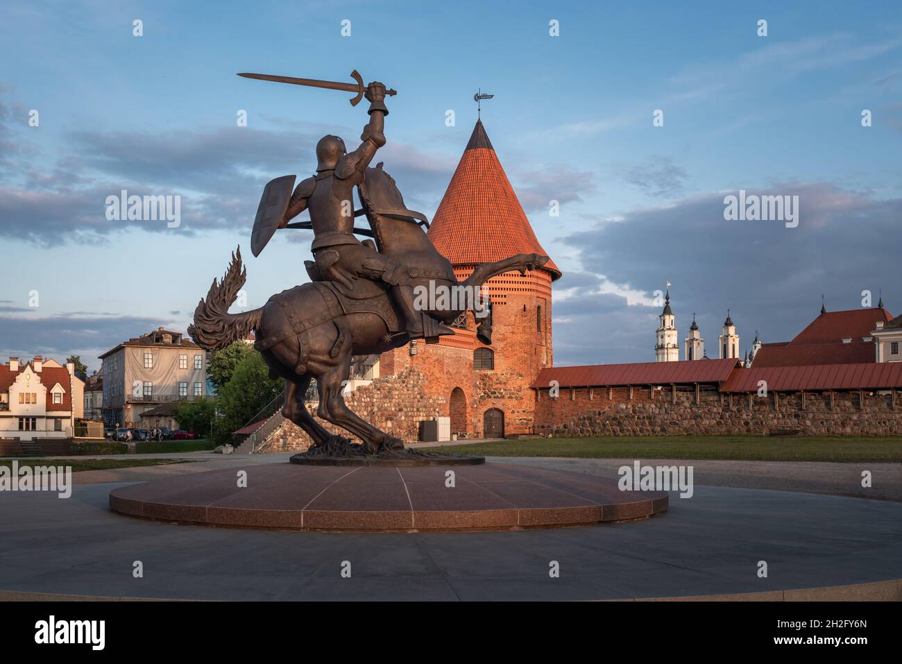 Vytis Sculpture, the Freedom Warrior - Lithuania National Symbol with Kaunas Castle on background - Kaunas, Lithuania Stock Photo