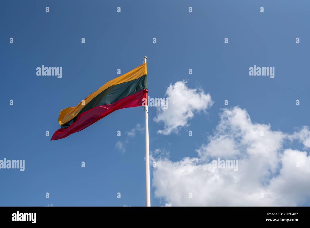 Lithuanian Flag on a blue sky with clouds - Lithuania Stock Photo