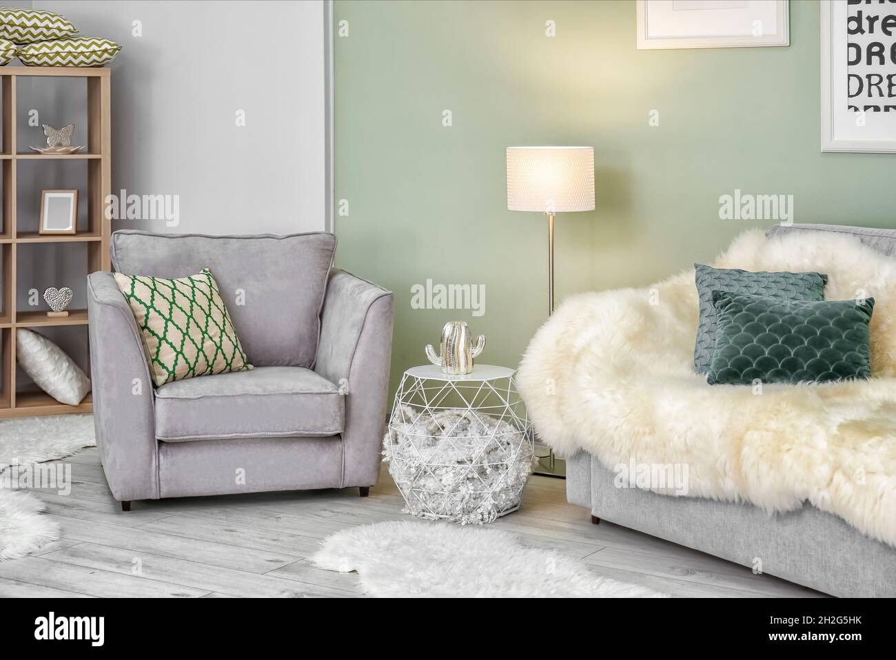 Modern room interior with cozy armchair and sofa Stock Photo - Alamy