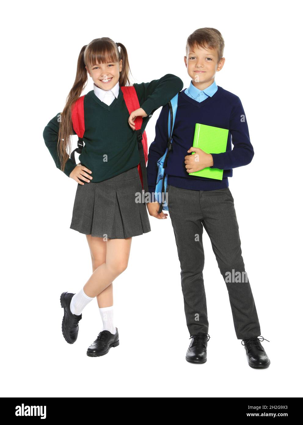 Little children in stylish school uniform on white background Stock ...