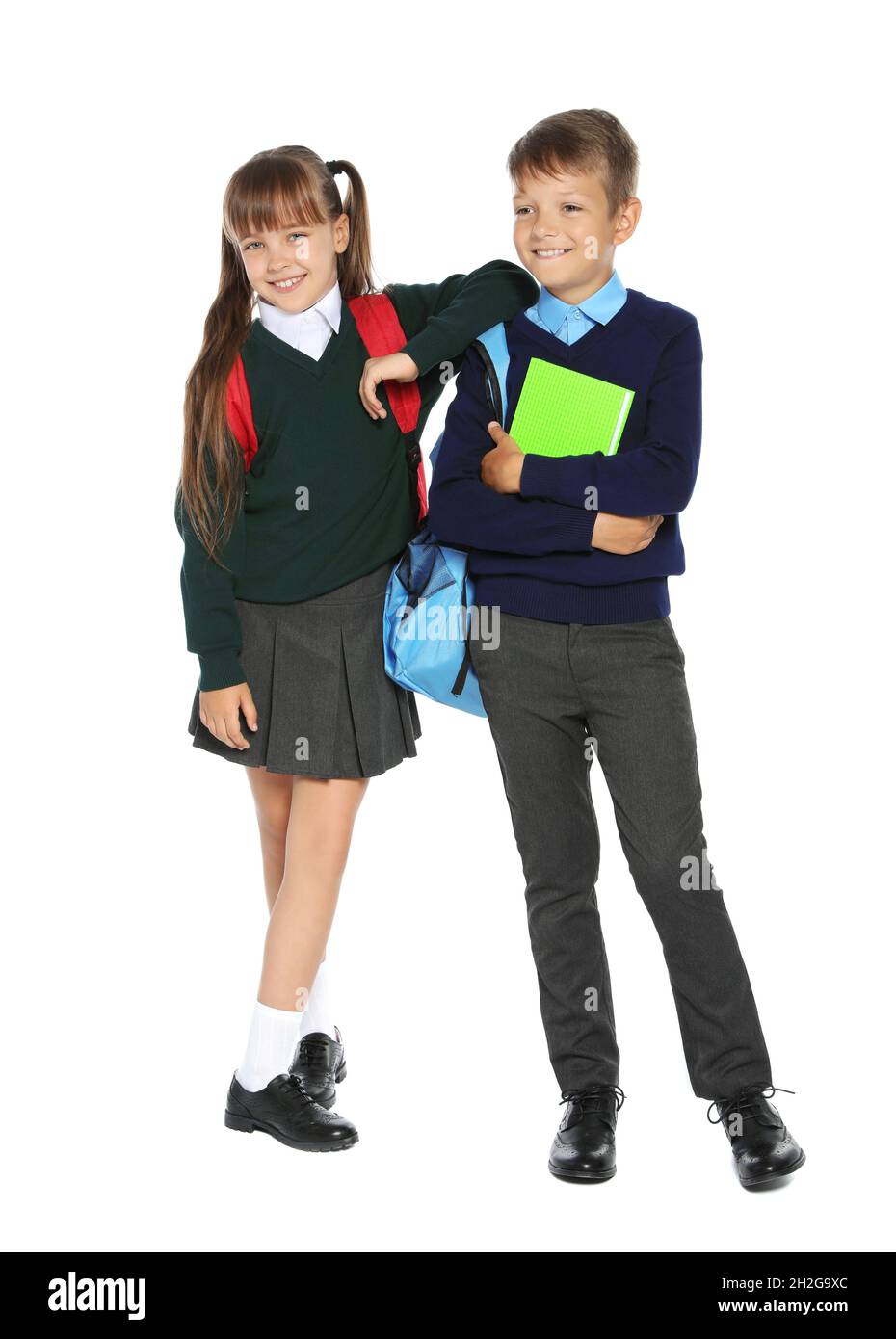 Little children in stylish school uniform on white background Stock ...