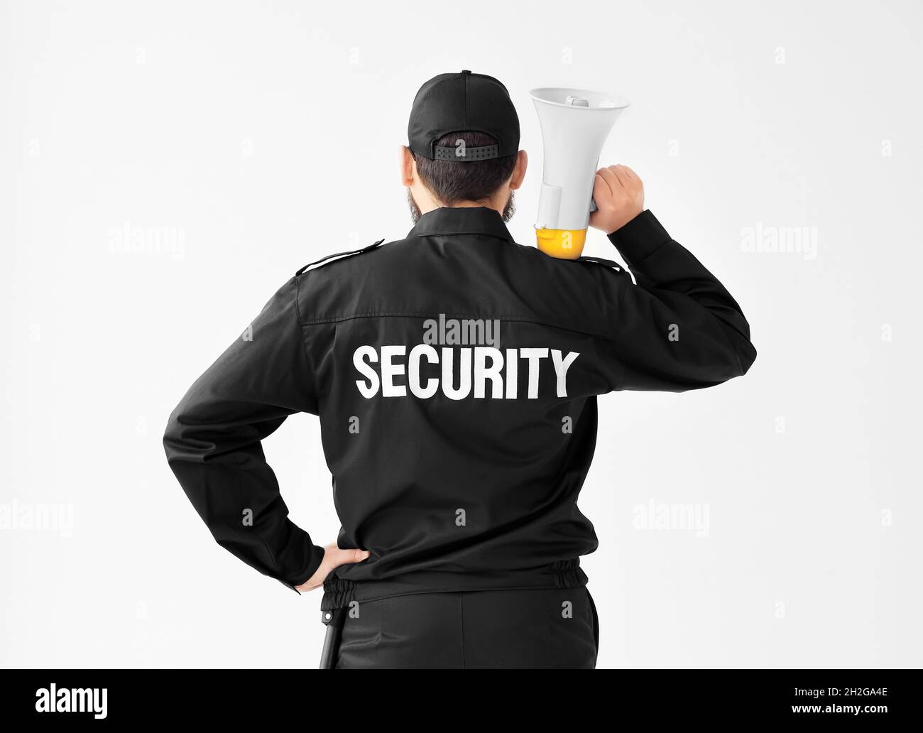 Security guard with megaphone on white background Stock Photo Alamy
