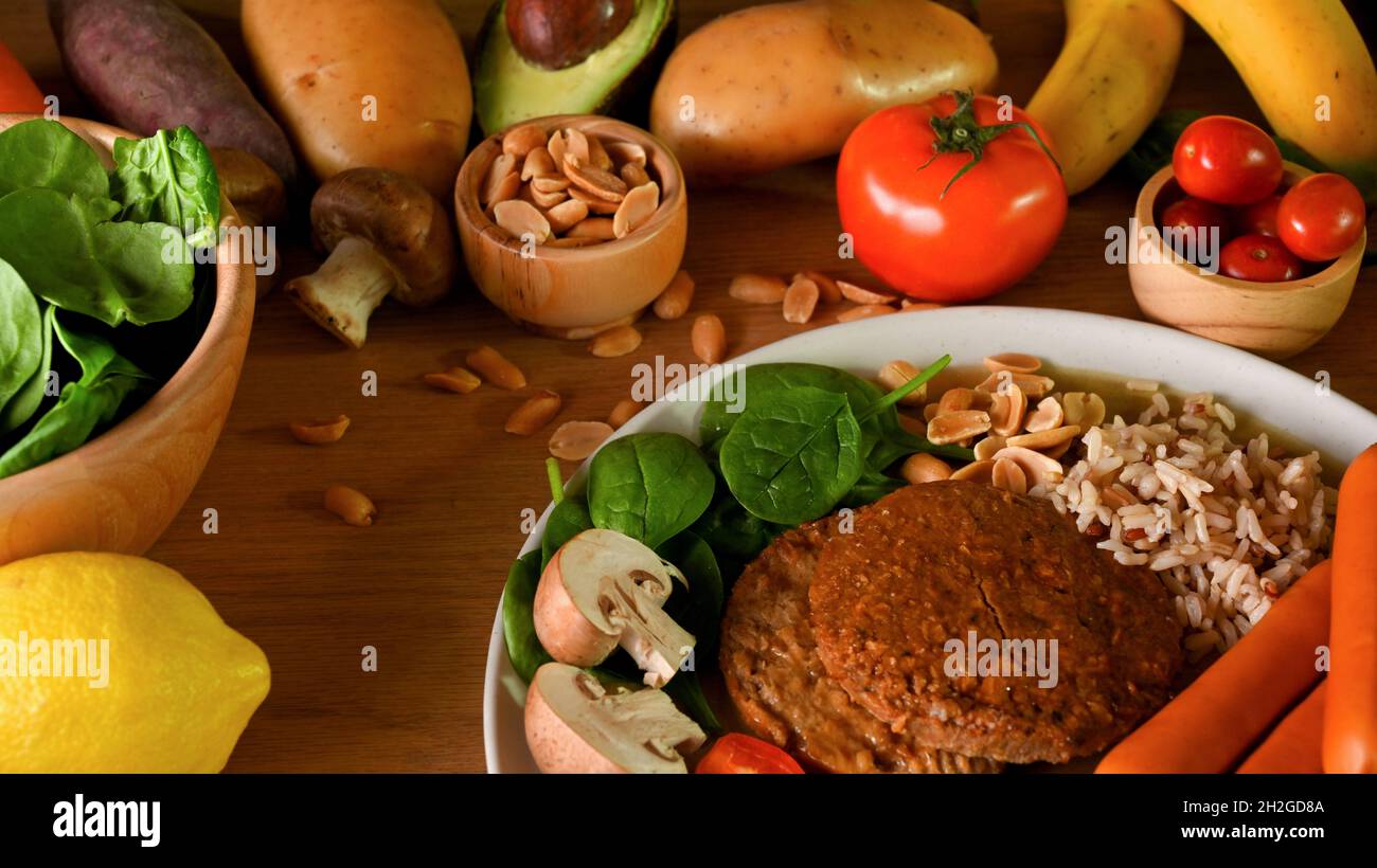 Close-up of a Soy protein burger meat with high fibre ingredients and vegetables surround by fresh vegetables. Stock Photo