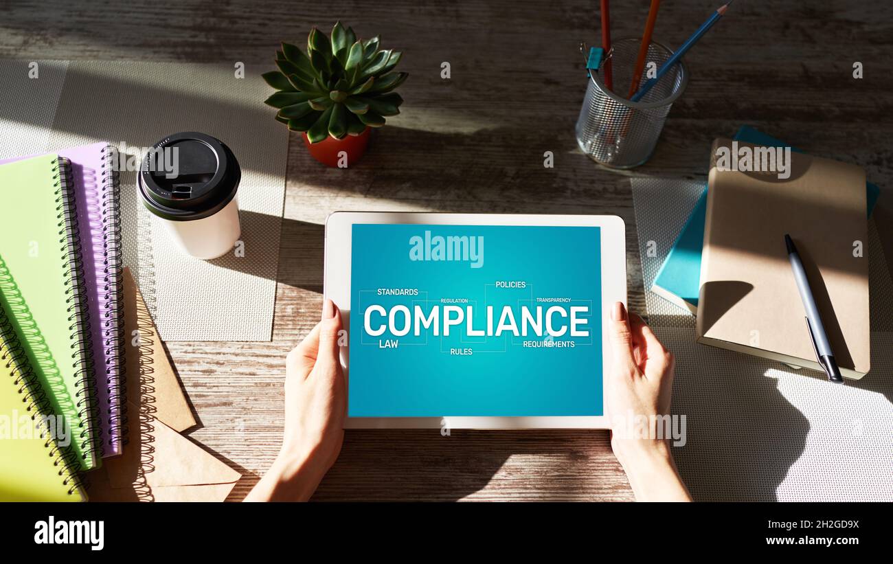 Compliance concept with icons and diagrams. Regulations, law, standards, requirements, audit. Concept on device screen. Stock Photo