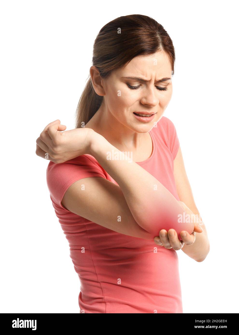 Mature woman suffering from elbow pain on white background Stock Photo Alamy