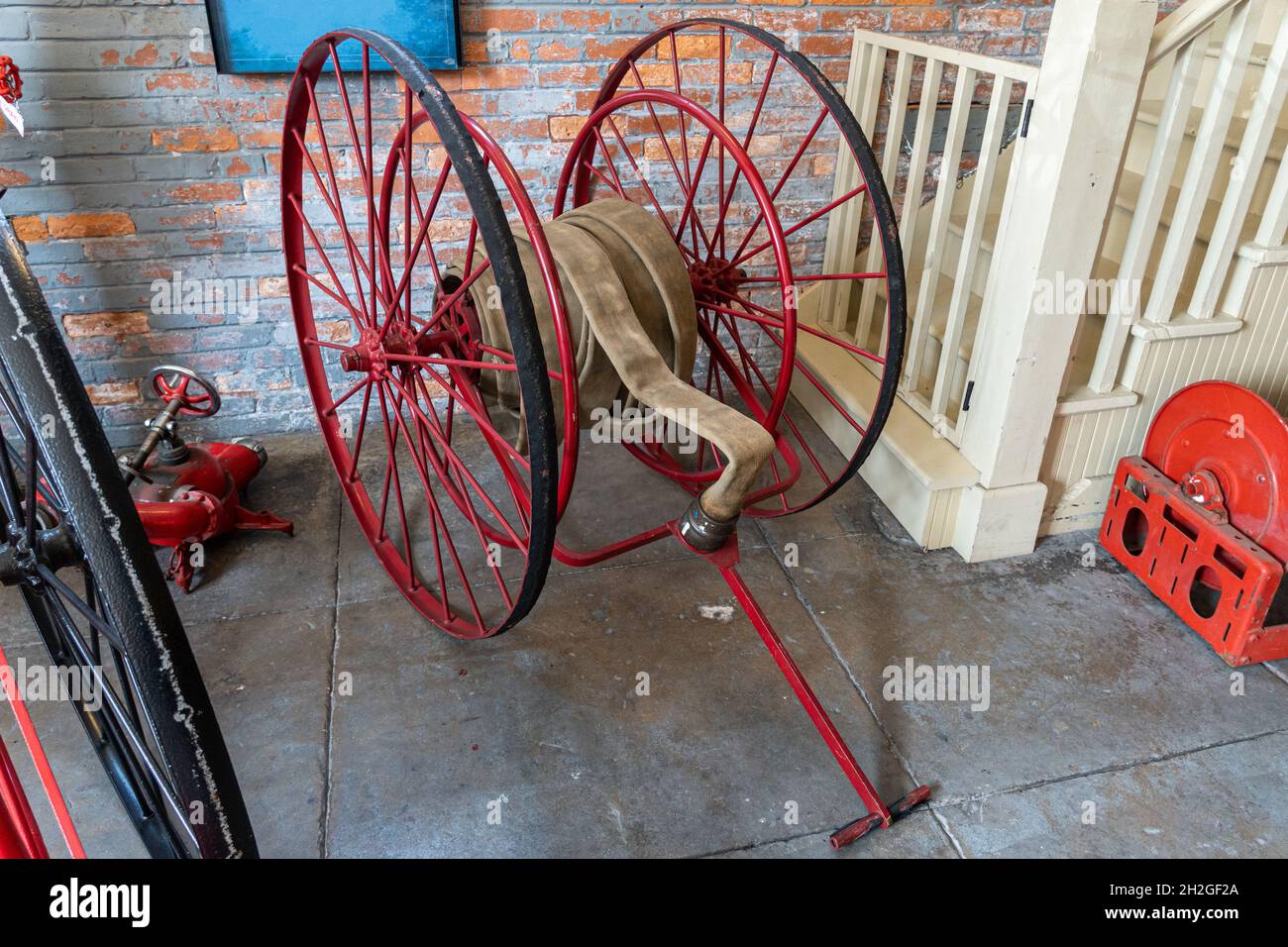 Old hand drawn hose cart for firefighting - Tampa, Florida, USA Stock Photo