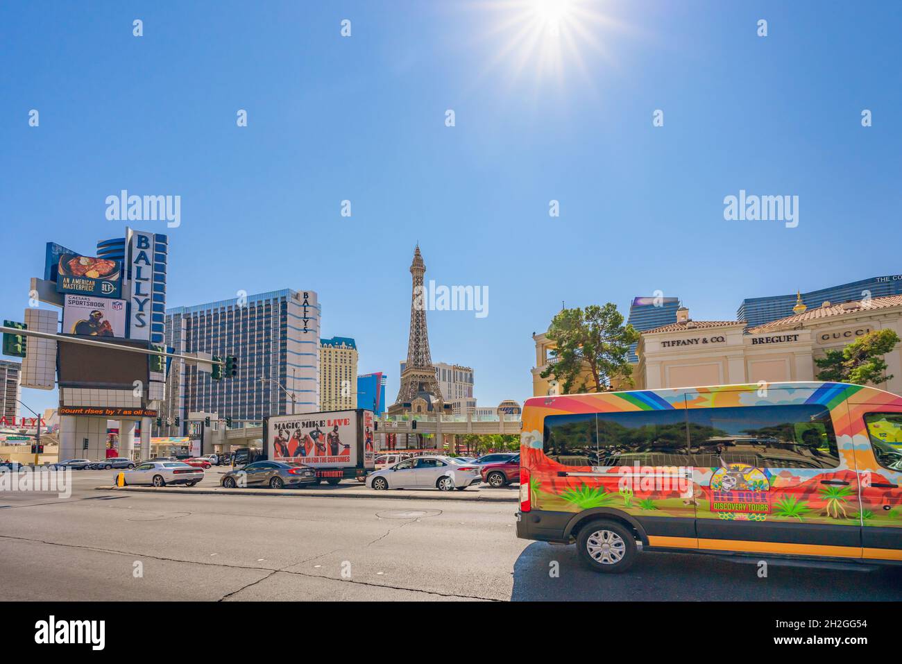 Las Vegas, Nevada, USA - October 1, 2021   Las Vegas Ballys Hotel, and Paris Hotel and Casino, street view, traffic, sunny day, clear blue sky backgro Stock Photo
