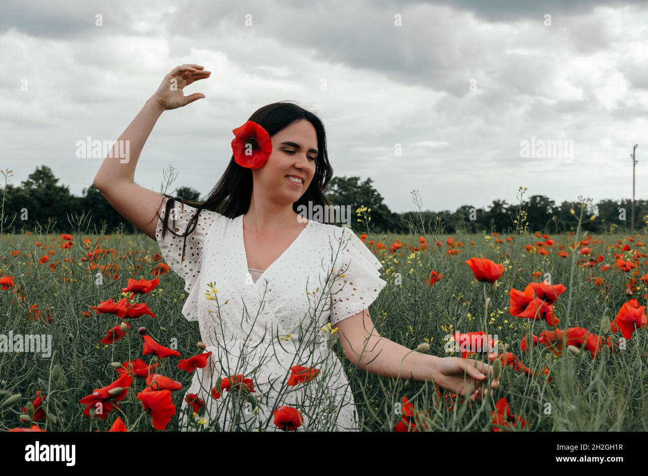 Woman in poppy field hi-res stock photography and images - Alamy