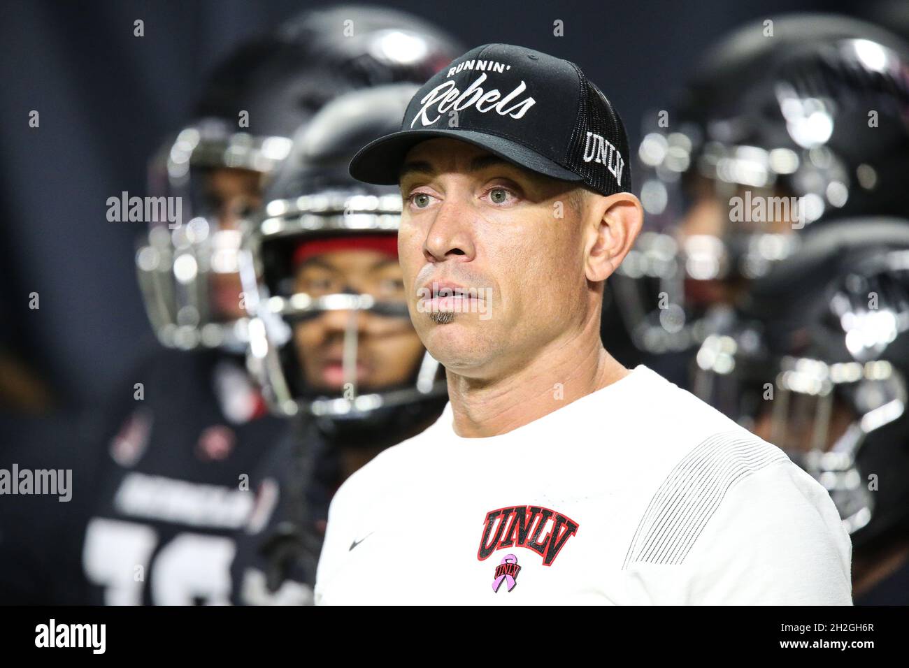 Las Vegas, US, October 21, 2021: UNLV Rebels head coach Marcus Arroyo waits  with his team prior to the start of the NCAA football game featuring the  San Jose State Spartans and