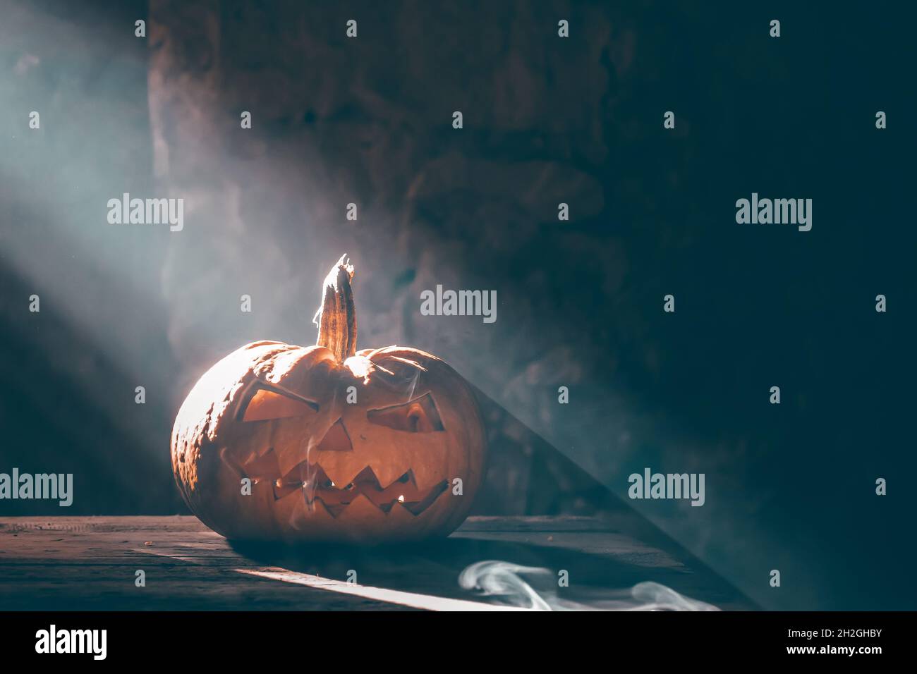 Jack O' Lanterns glowing in smoky fantasy night. Halloween background ...