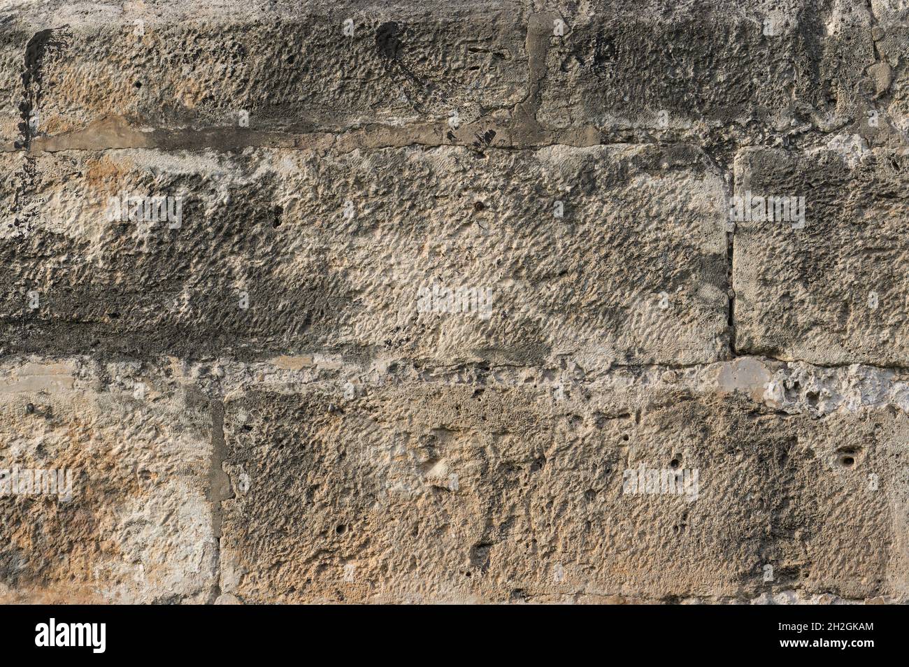 brown old wall on detail of large pieces of stone as bricks rectangular ...