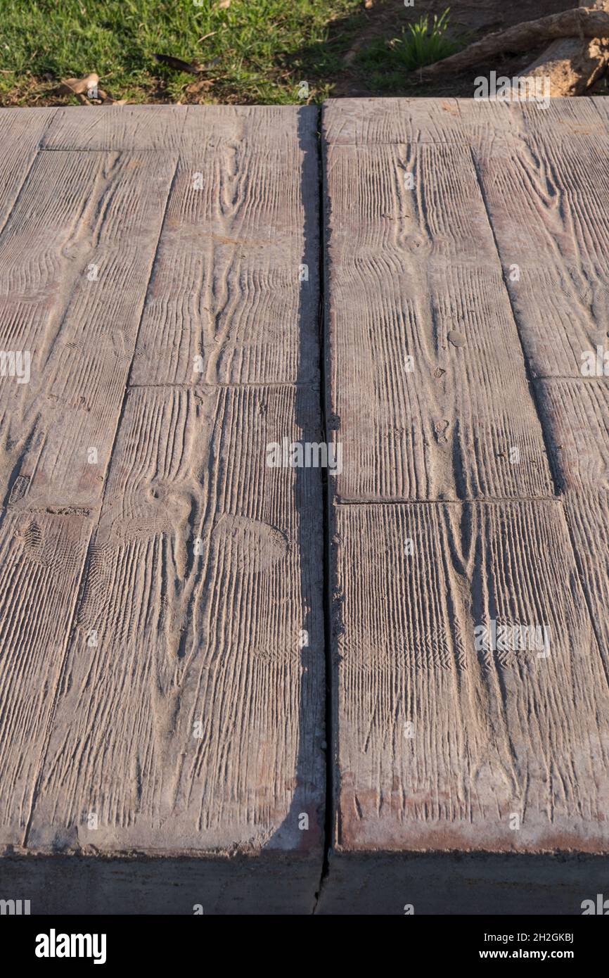 Expansion joint at stamped concrete pavement, Footprints that were marked when stepping when it