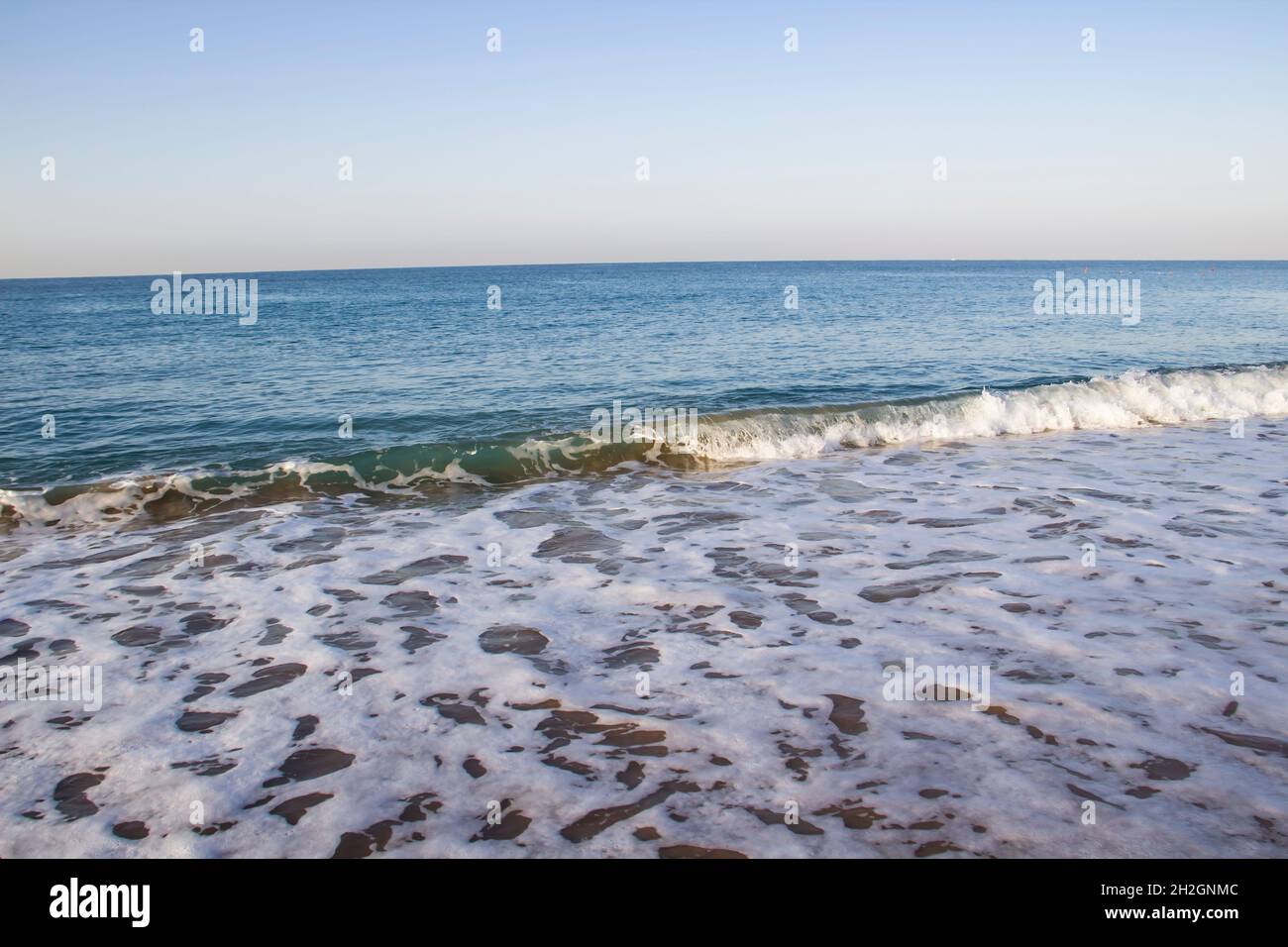 Beautiful seascape with sea waves and sand. Sea waves on the beach. Stock Photo