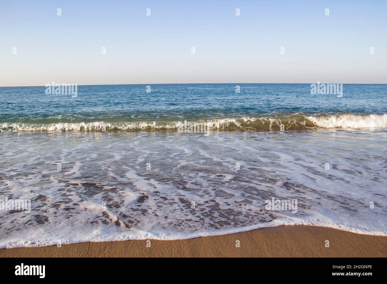 Beautiful seascape with sea waves and sand. Sea waves on the beach. Stock Photo
