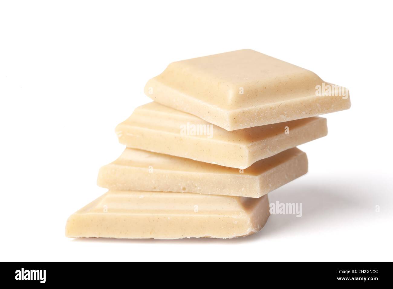 Three pieces white chocolate arranged in a pile isolated on white background Stock Photo